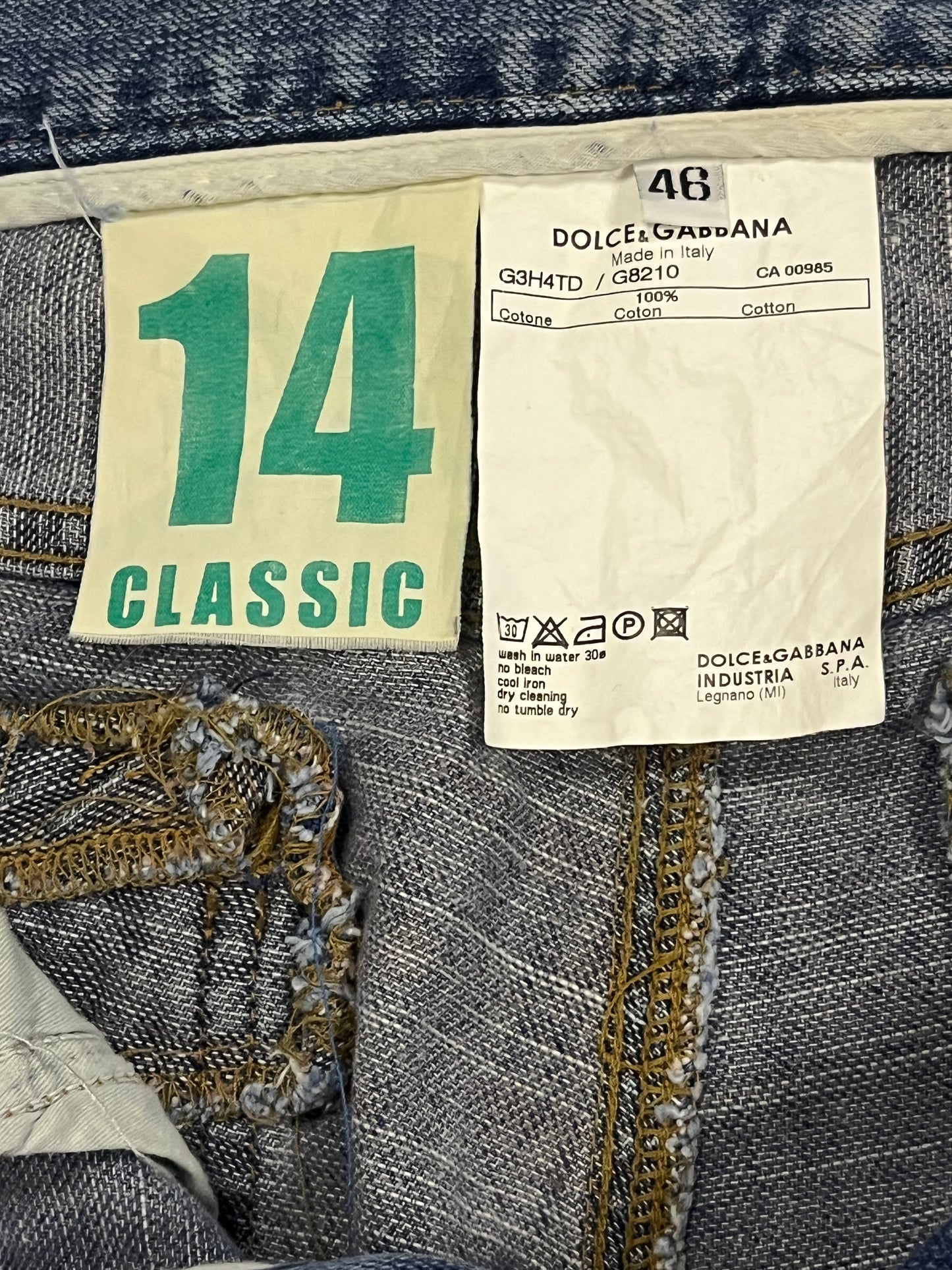 Dolce & Gabbana Gold Plaque Ripped Denim Jeans